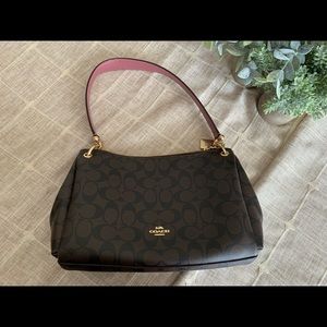 Coach handbag with signature canvas brown and leather pink strap